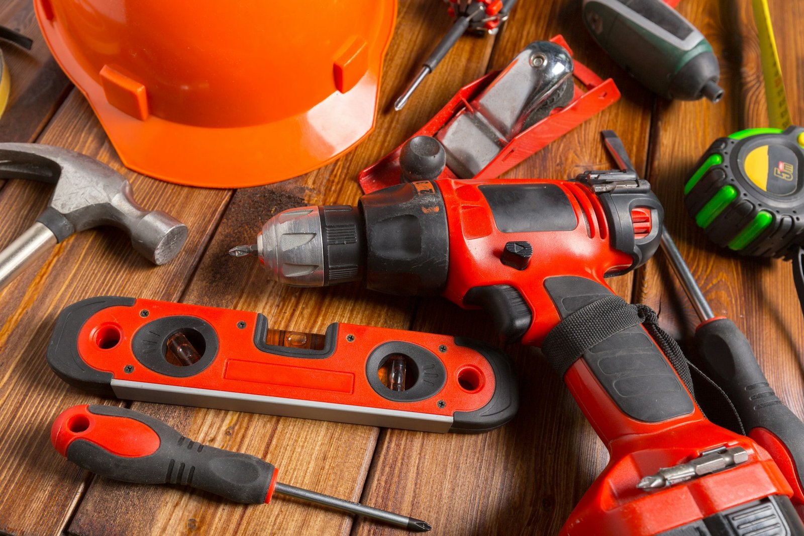 Assorted work tools on wood background